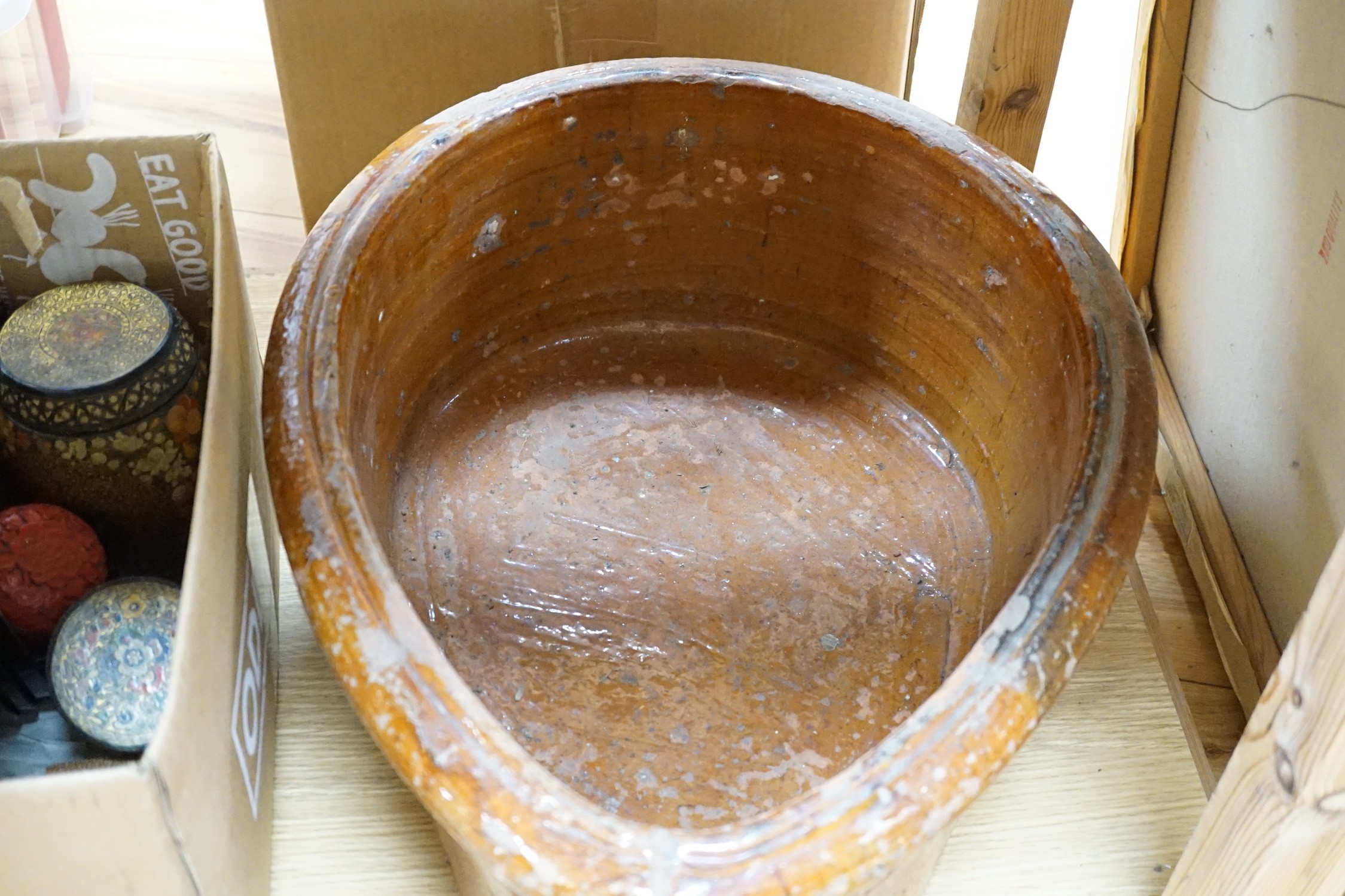 A 19th Century French terracotta ham-smoking pot with original wooden lid